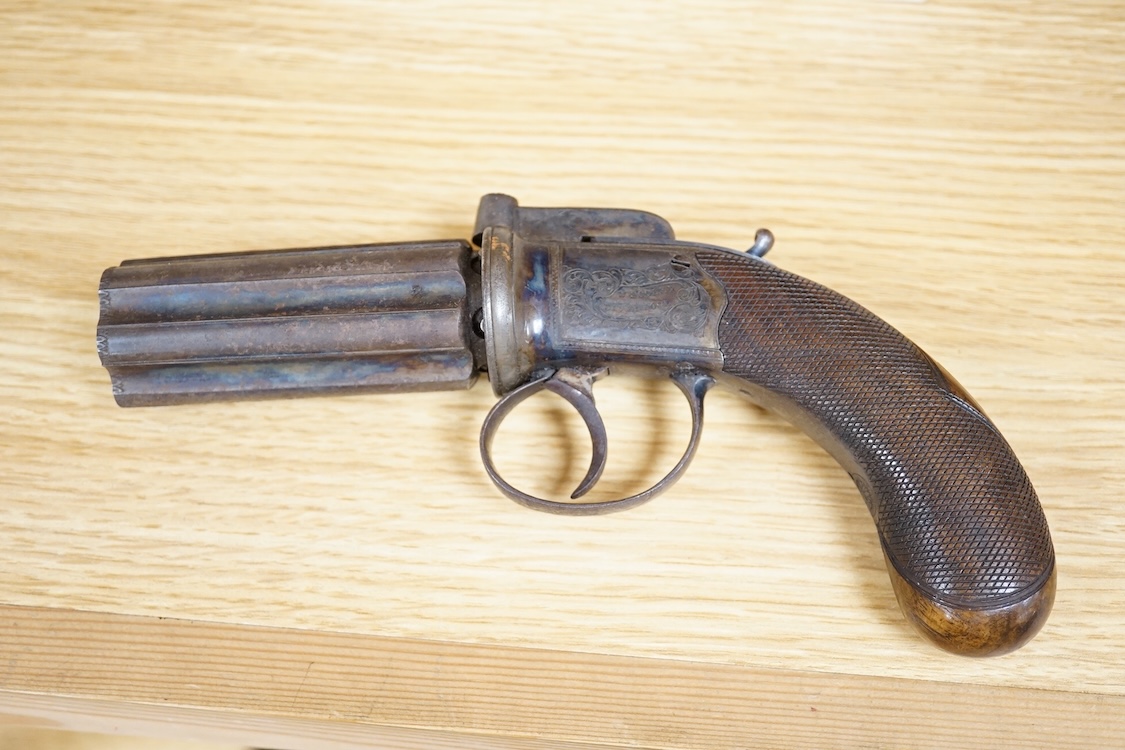 A six shot 80 bore, self-cocking, pepperbox revolver signed; W. Dooley, Liverpool, with foliate engraved frame and fluted barrel, Birmingham proved, and one piece rounded chequered walnut grip, together with a small copp